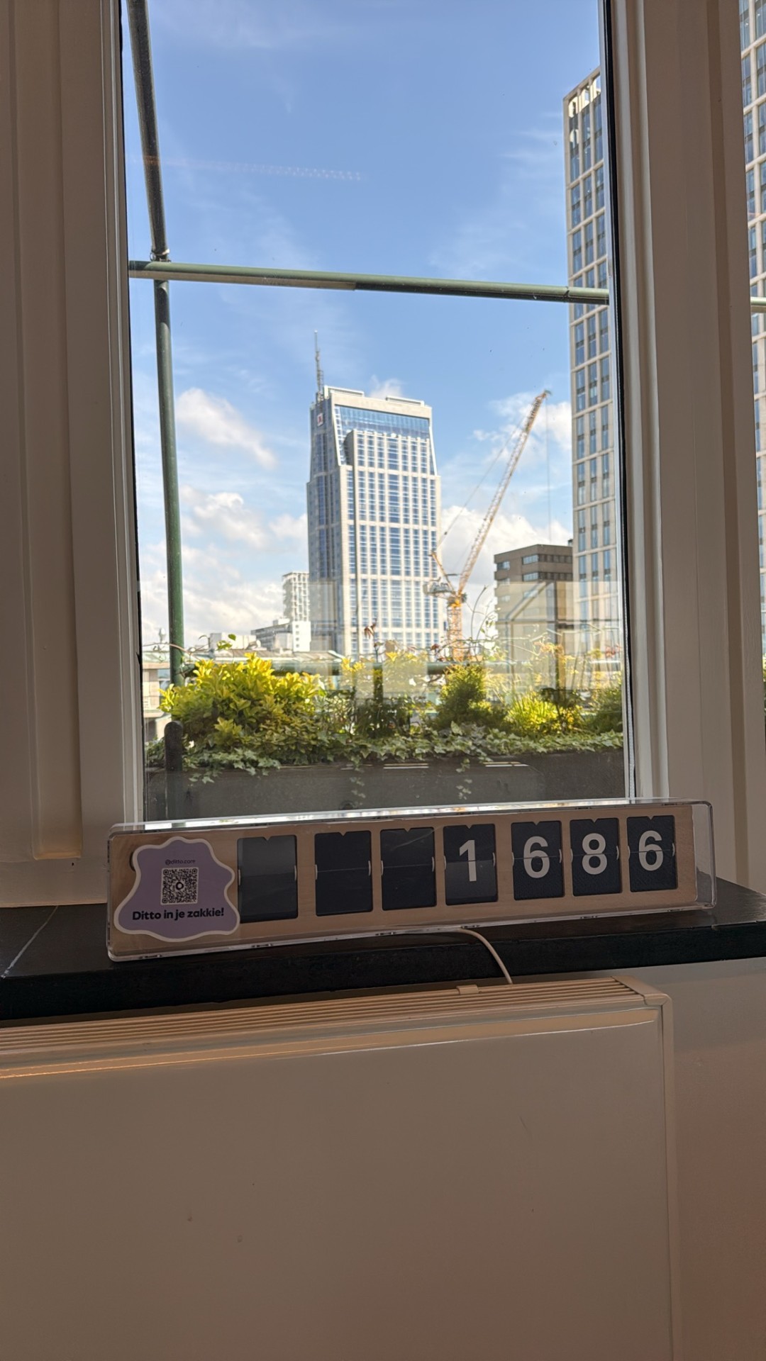 Flip counter showing 1686 in front of the skyline