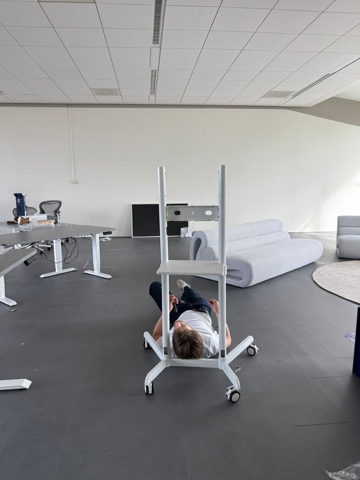 Engineer under TV cart